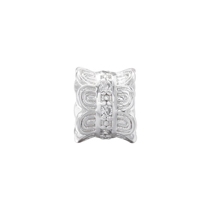 Macro shot of silver butterfly spacer bead with three round cubic zirconia crystals