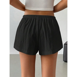 Women's black casual shorts with elastic high waist and breathable crinkle texture