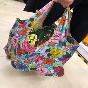 Floral nylon shopping bag showcasing high load-bearing capacity with large heavy items