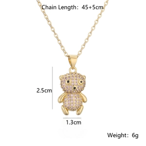 Detail shot of gold-plated bear pendant with pink zircons and product measurements