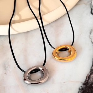 Minimalist 18k gold and silver plated donut pendants on black leather cords