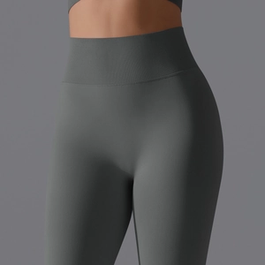 Close-up of wide ribbed high waistband on seamless dark grey compression yoga leggings