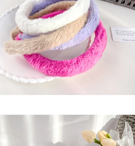 Close-up of five thick plush faux rabbit fur headbands in various pastel candy colors