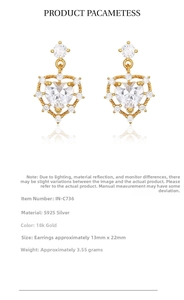 Detail showing S925 sterling silver heart earrings with gold plating and zircon inlay