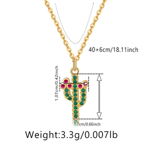 Detailed view of gold cactus pendant necklace with green rhinestones and size measurements