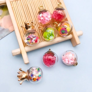 DIY glass ball pendants with colorful star sequins and fruit slices for jewelry making