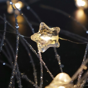 Warm yellow star-shaped LED fairy lights with silver glitter branches decoration