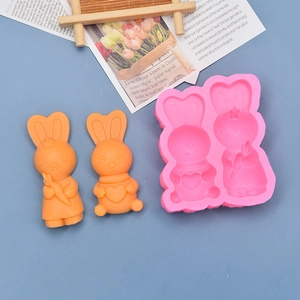 Detail of pink silicone rabbit mold featuring carrot and floral patterns for Easter baking