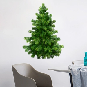 Detail of green pine Christmas tree wall decal set on a white wall in a modern dining room