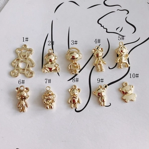 Golden DIY alloy pendant charms set featuring hollow bear and astronaut designs