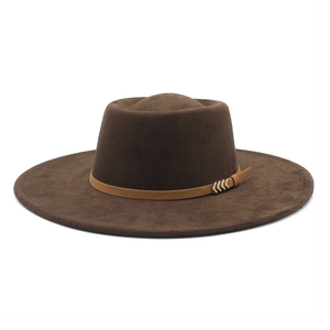 Detail of dark brown faux suede boater hat with leather band and gold metal hardware
