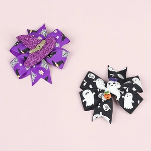 Detail of Halloween bow hair clips with witch hat, pumpkin, and ghost festive patterns