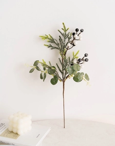 Detail of Christmas wreath branches with eucalyptus leaves, pine needles and white berries