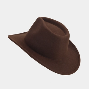 Detail view of the high-quality dark brown wool felt fabric and wide brim on this cowboy hat