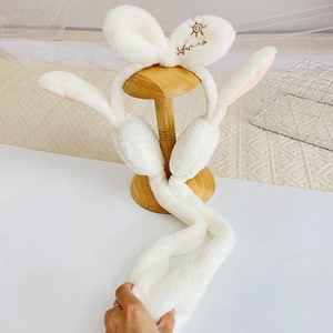 White plush bunny earmuffs with moving ears and embroidered sun pattern for girls
