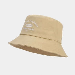 Detail of khaki bucket hat with vintage white lettering and neat brim stitching