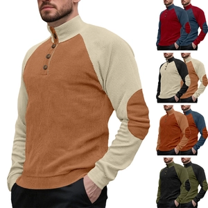 Detail of color-block knit sweater featuring a stand collar and buttoned placket for men