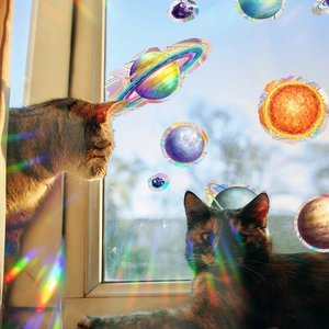 Rainbow prism suncatcher window decals with planet and saturn holographic designs