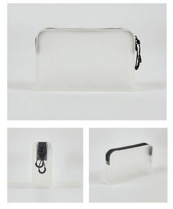 Three-way view of frosted translucent makeup bag with black zipper and strap