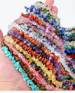 Macro shot of assorted colorful irregular natural crystal and agate stone beads for DIY jewelry