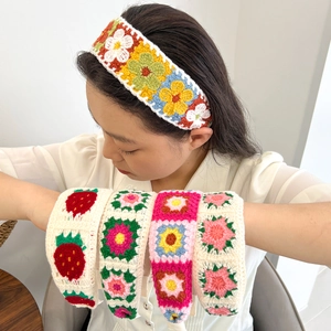 Knitted headband with colorful floral and strawberry patterns for a summer vintage look