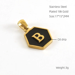 Detailed macro view of 18k gold plated stainless steel hexagonal pendant with letter B