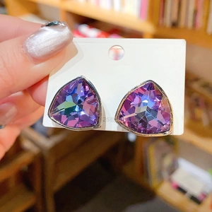 Close-up of purple triangle crystal earrings with 925 silver needle detail