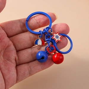 Blue and red star and umbrella keychain with colorful bells on a minimalist hook