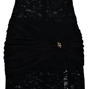 Close-up of black lace dress waist featuring pleated fabric and golden metal buckle detail