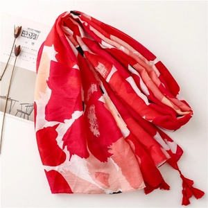 Red bohemian cotton-linen scarf with abstract floral print and fringe tassels