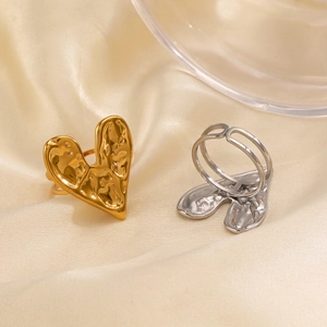 Gold and silver heart rings with lava texture and adjustable open bands