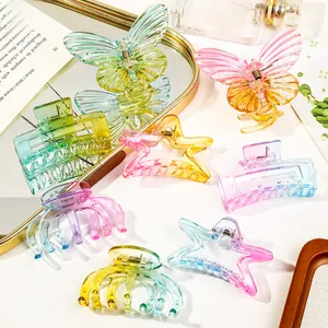 Macro detail of various gradient colorful butterfly and star shaped square hair claw clips