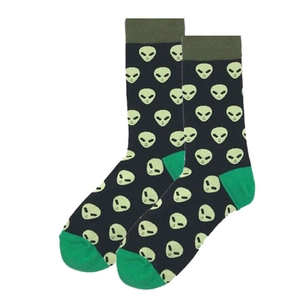Detail shot of black cotton socks featuring green alien jacquard patterns and green toe caps