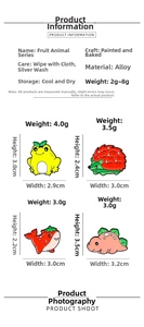 Size guide for cartoon animal fruit badges showing dimensions of frog and dinosaur pins