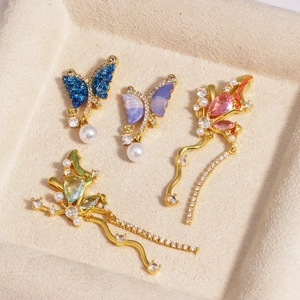 Asymmetric butterfly and flower pendant set with micro-set zircon and pearl details