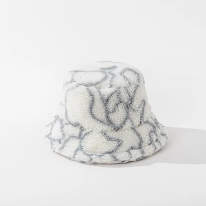Detailed view of striped lamb wool bucket hat texture and soft gray abstract pattern