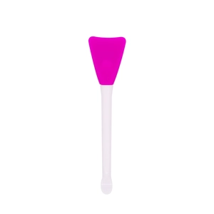 Dual-ended pink silicone face mask brush with white handle for professional skincare