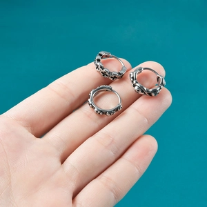 Punk vintage silver stainless steel earrings featuring skull and cross relief designs