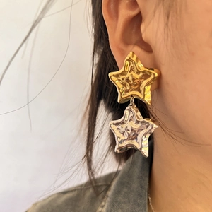 Minimalist 18K gold and silver two-tone star drop earrings with hammered texture