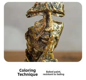 Close-up of golden bronze sculpture showing lacquer finish and textured surface
