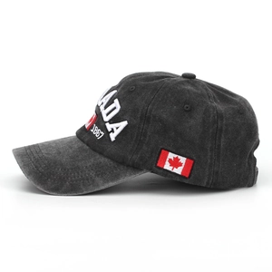 Classic washed black baseball cap with white 3D Canada embroidery and leaf flag detail