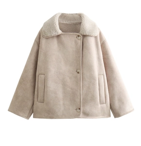 Detail of faux suede jacket featuring warm shearling lapel collar and button closure