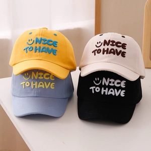 Kids' smiling face embroidery baseball caps in yellow, white, blue and black cotton