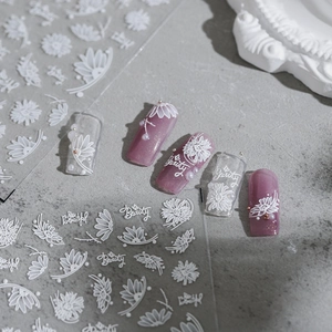 Minimalist 3D white daisy embossed nail art stickers with elegant floral relief patterns