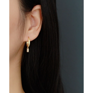 Elegant s925 silver gold-plated hoop earrings with rectangular zircon pendant on a model