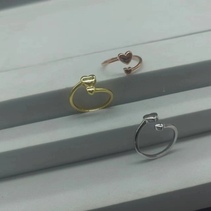 Detailed view of S925 sterling silver double heart open rings in rose gold, gold and silver