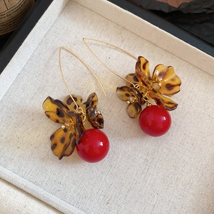 Vintage leopard print acrylic flower earrings with bold red pearl pendants and gold hooks