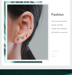 Close-up of S925 silver stud earrings featuring colorful crystal fruit and vegetable designs