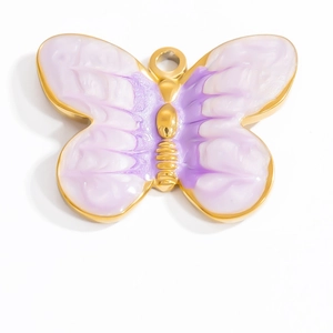 Detailed macro view of 18K gold butterfly pendant with purple enamel gradient and ring