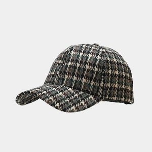 Detail view of the thick houndstooth woven texture on a vintage baseball cap surface